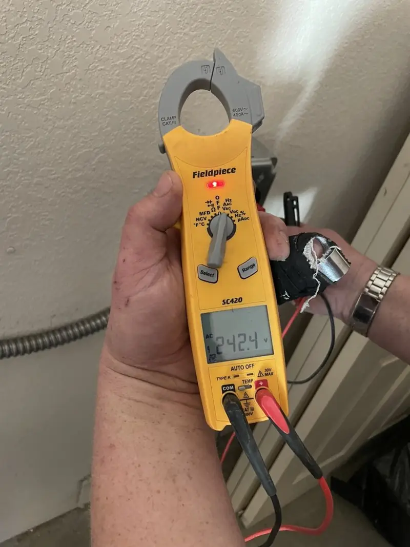 Voltage testing with clamp meter during Aluminum Wiring Replacement in College
